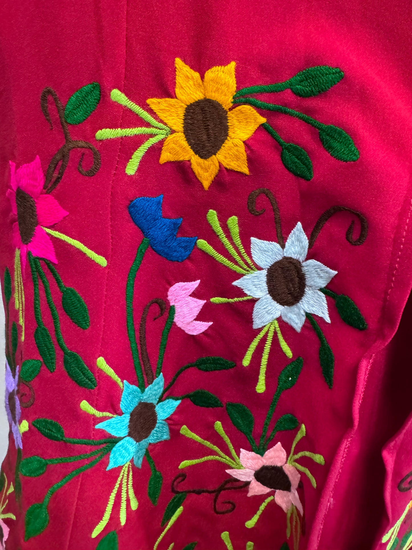 Geminis fitted, floor-length dresses with a modern Mexican-inspired aesthetic